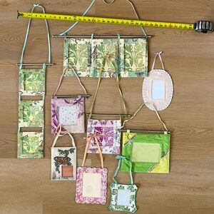 Anthropologie fabric wall frames of various sizes and materials.